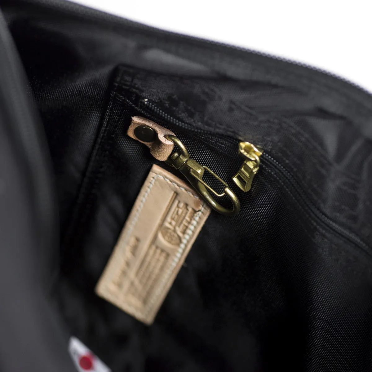 "Surpass" roll-top backpack, black Cordura and natural leather