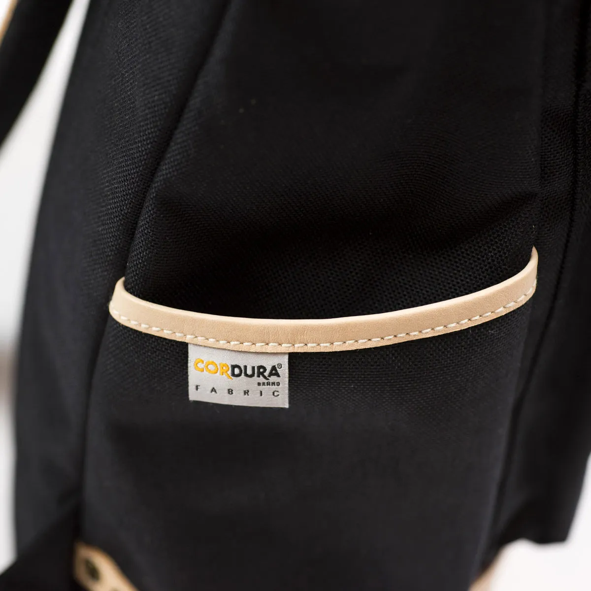 "Surpass" roll-top backpack, black Cordura and natural leather